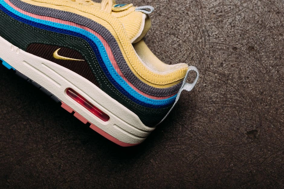 Colorful Nike Air Max sneaker showcased on a textured surface, highlighting modern fashion.