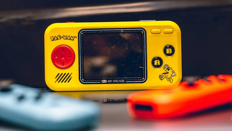 Colorful close-up of a Pac-Man themed My Arcade Pocket Player. Perfect for retro gaming enthusiasts.