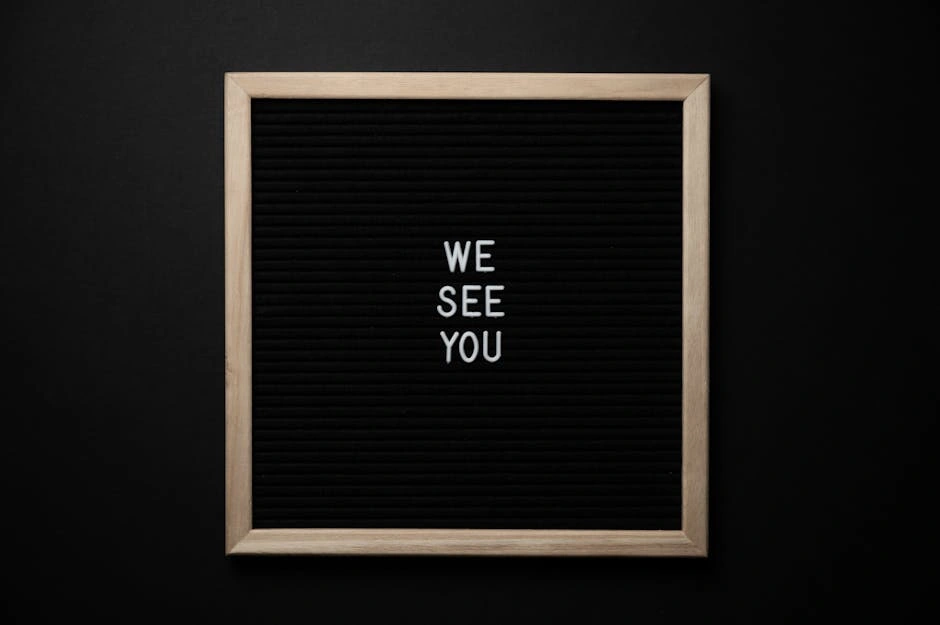 Black letter board with the message 'We See You' on a dark background, conveying a theme of awareness.