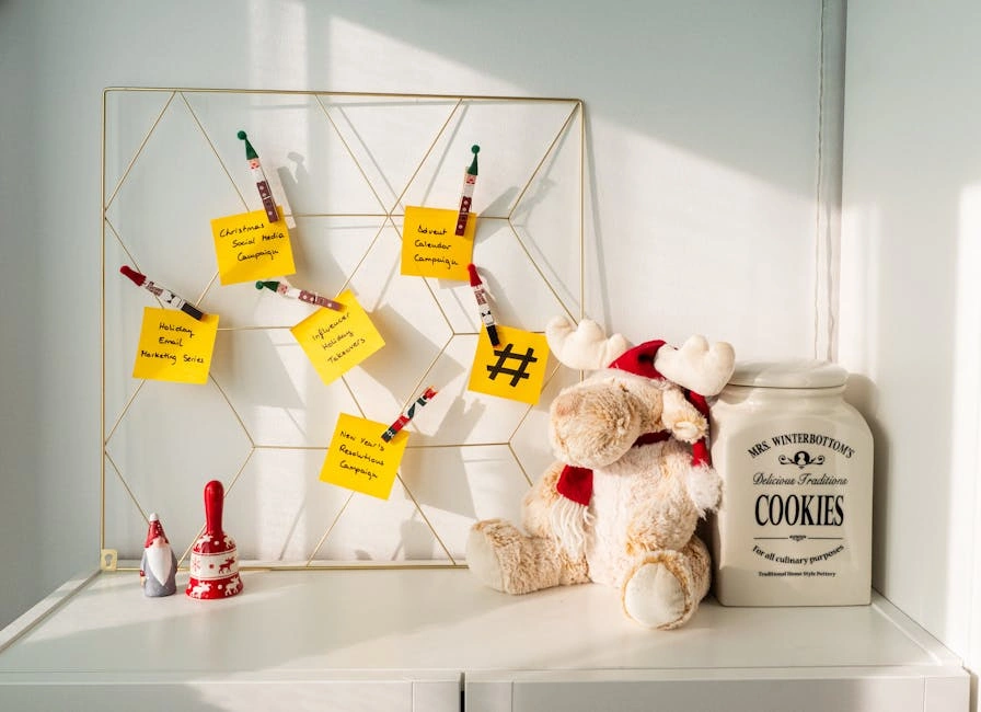 Cozy office corner with festive notes, a teddy bear, and cookie jar.